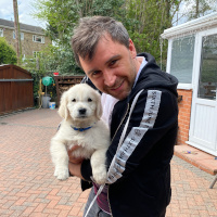 Me smiling while holding my mum's dog, Kodi
